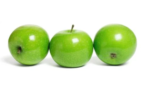 Three green apples Stock Photos