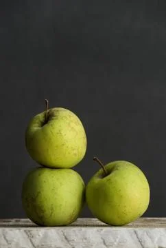 Three green apples Stock Photos
