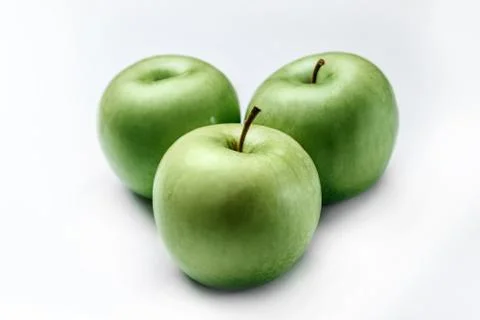 Three green apples Stock Photos