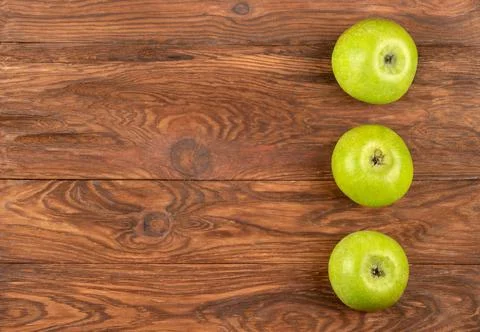 Three green apples Stock Photos