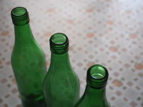 Three green bottles Stock Photos