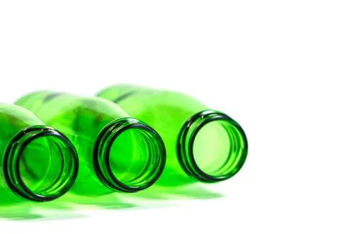 Three Green Bottles on White Background with focus on center bottle Stock Photos
