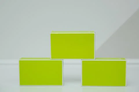 Three green cardboard boxes, standing on the table Stock Photos