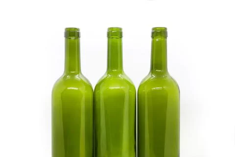 Three green empty wine bottles on a white background Stock Photos