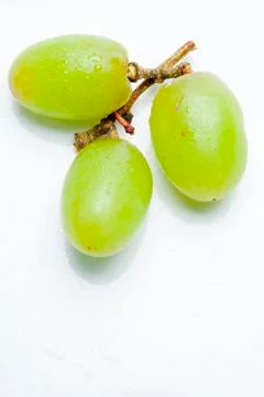 Three green grapes Stock Photos