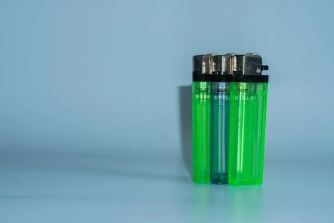 Three green lighters stand side by side Fotos de archivo