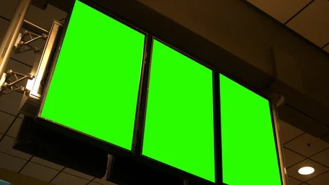 Three green screen airport technology screens for departure schedule Stock Footage 92964952