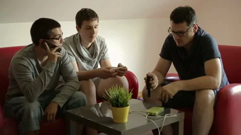 Three guys are using their smartphones Stock Footage 65045535