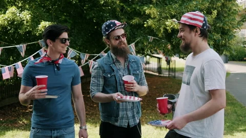 Three guys having a chat at 4th of July Party Stock Footage 133600361