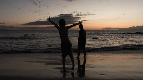 Three Guys Having Fun On Beach Vacation Video stock 106827802