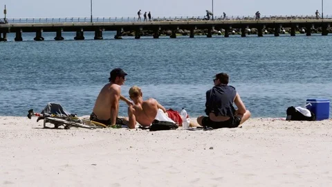 Three guys sunbathing Stock Footage 82413308