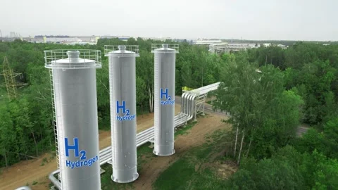 Three H2 Hydrogen storage tanks stand in a green forest. Stock Footage 282990825