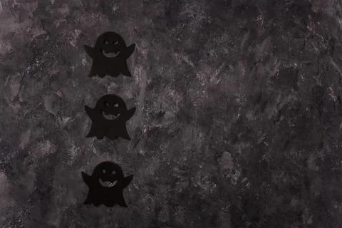 Three Halloween black ghosts shape stickers on grey background. Halloween Stock Photos