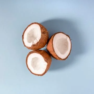 Three halves of coconut Stock Photos