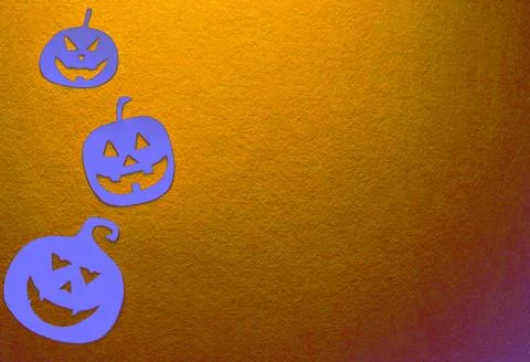 Three hand-painted pumpkins on a yellow background Stock Photos