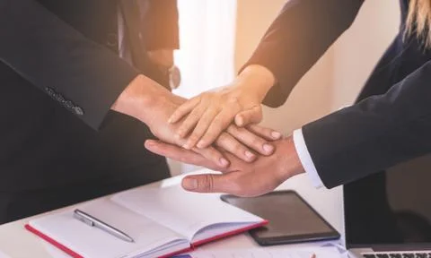 Three hand stack together for business team success cocnept Stock Photos