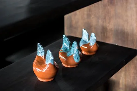 Three handcrafted ceramic vases with turquoise drip glaze Stock Photos