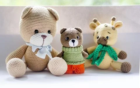 Three handmade knitted bears. Perfect for crafts, children's toys and unique  Stock Photos