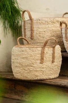 Three Handmade Woven Wicker Baskets on Rustic Wooden Stairs Stock Photos
