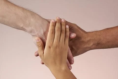 Three hands together Stock Photos