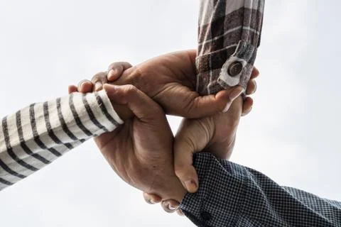 Three hands were a collaboration concept of teamwork Stock Photos