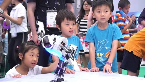 Three Happy Kids Exploring Robotic Technology Video stock 77176168