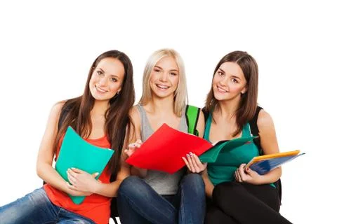 Three happy students standing together with fun, while smiling and looking at Stock Photos