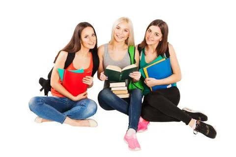 Three happy students standing together with fun, while smiling and looking at Stock Photos