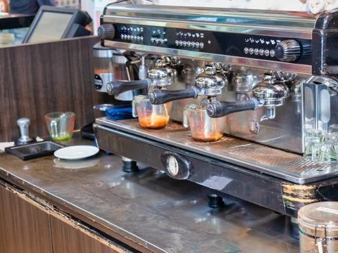 Three head professional coffee machine., making Two espresso cups in the coff Stock Photos