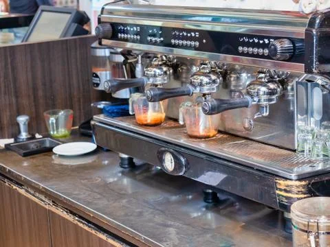 Three head professional coffee machine., making Two espresso cups in the coff Stock Photos