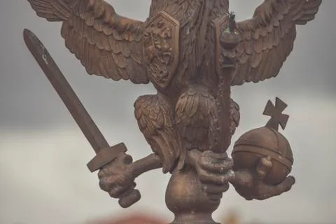 Three-headed eagle with sword and sceptre of power symbol of tsarist Russia Фото
