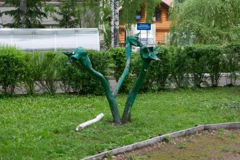 Three-headed serpent-dragon (made of wood sculpture in the park) Stock Photos