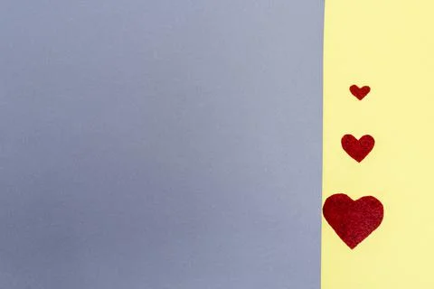 Three hearts. background grey yellow.concept Valentine's Day postcard Stock Photos