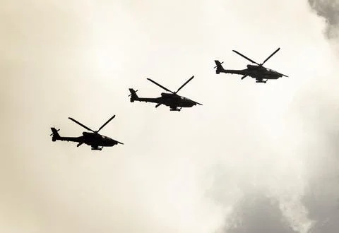 Three helicopters in flight. Stock Photos