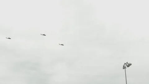 Three Helicopters Flying Overhead Stock Footage 77248270