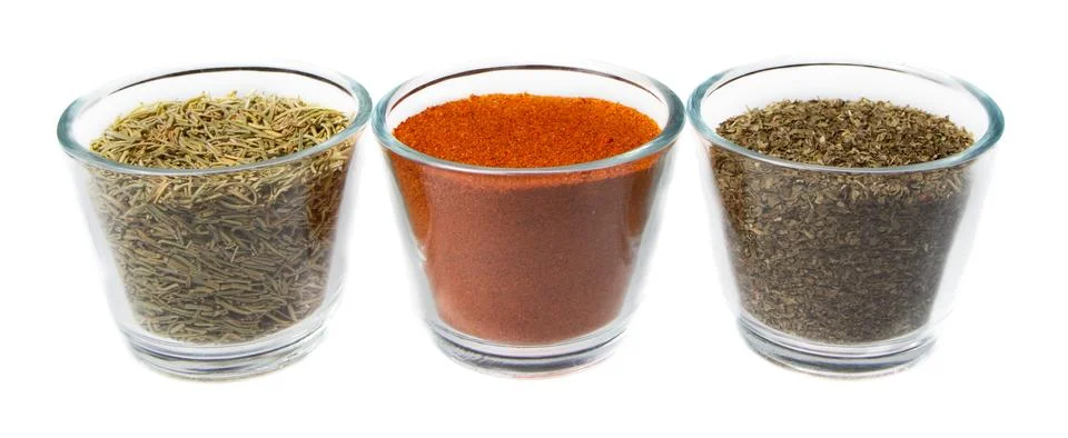 Three herbs in jars Stock Photos