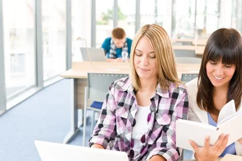 Three high school students in classroom with laptop Stock Photos