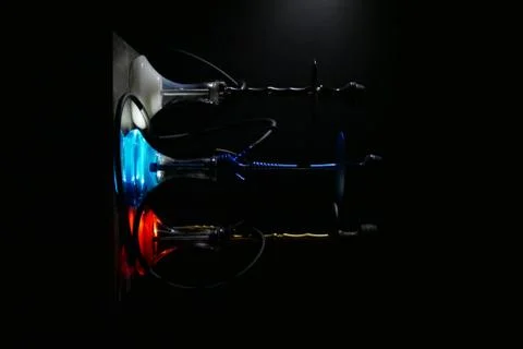 Three hookahs in the dark Stock Photos