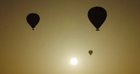Three hot air balloons in Cappadocia, Turkey, in the morning Stock Footage 252000954