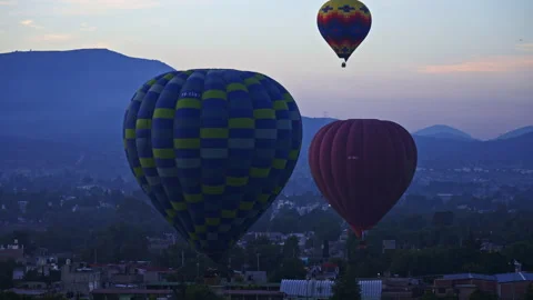Three hot air balloons taking off early in the morning Stock Footage 266139961