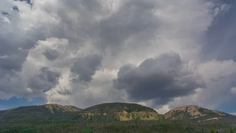 Three Hump Mountain Range Massive hills with rolling clouds overhead Time Lap Stock Footage 129356625
