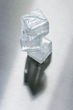 Three ice cubes in a pile Stock Photos