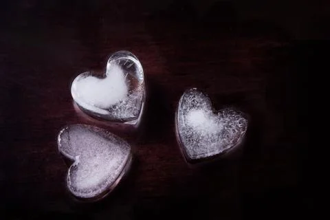 Three ice hearts on a black background Stock Photos
