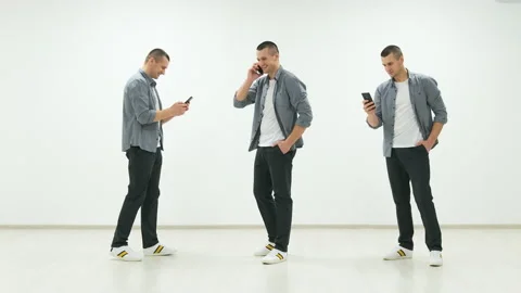 The three identical men talking on the phone Stock Footage 151309065