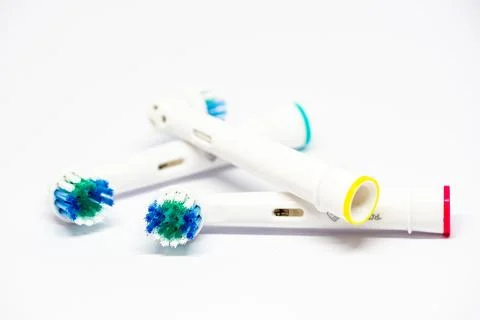 Three interchangeable heads for a electric toothbrush Stock Photos