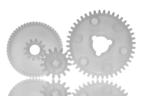 Three interlinked gear wheels Stock Photos