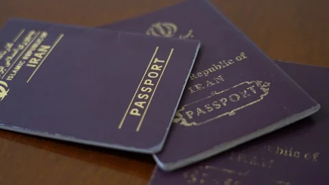 Three iranian passport Stock Footage 125525866