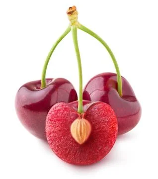 Three isolated cherries, one cut in half Stock Photos