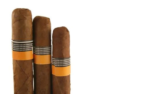 Three isolated cigars on white Stock Photos