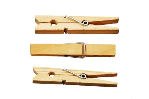 Three isolated clothes pins Photos